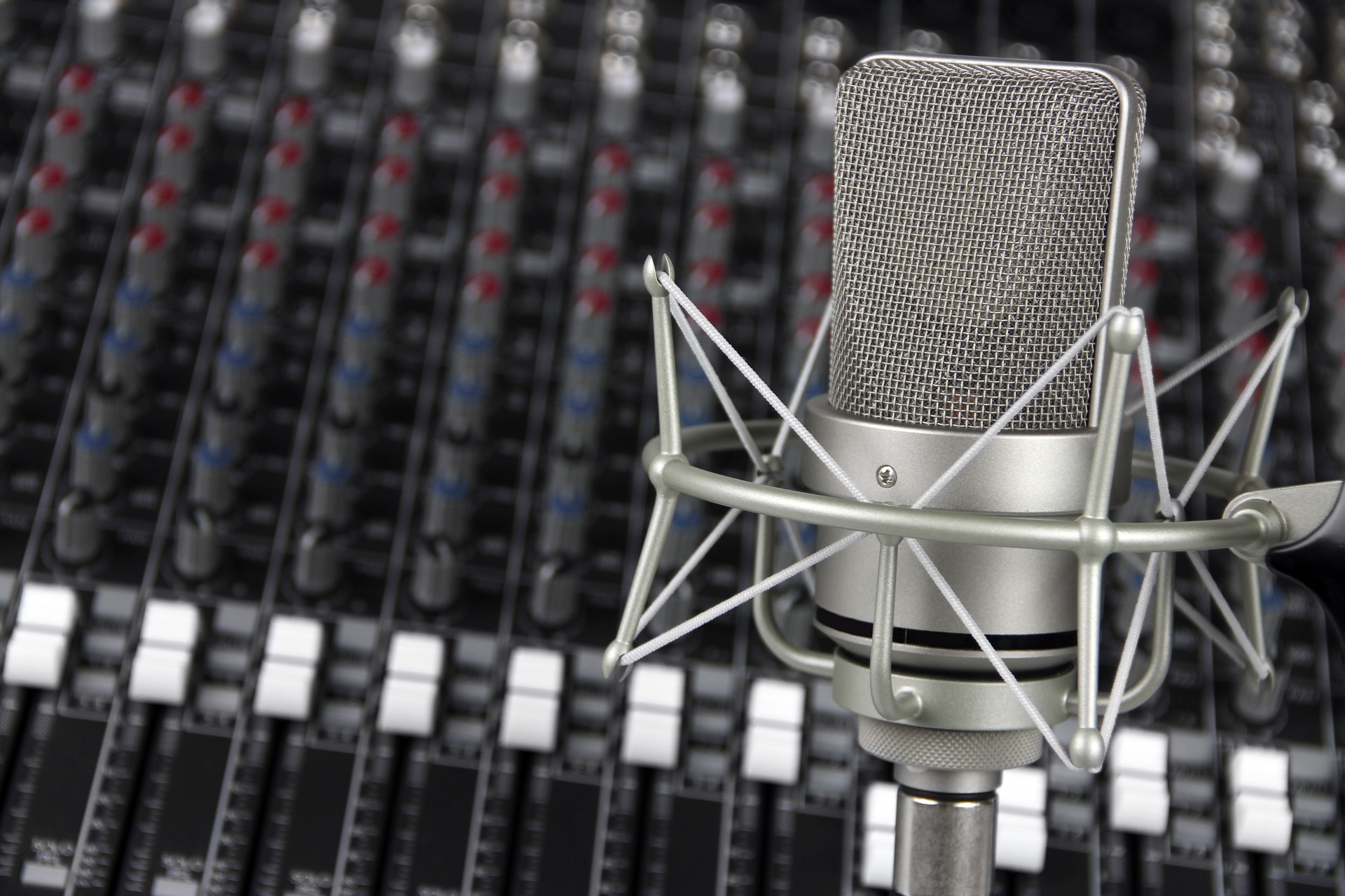 Studio Microphone with Mixer in the Background